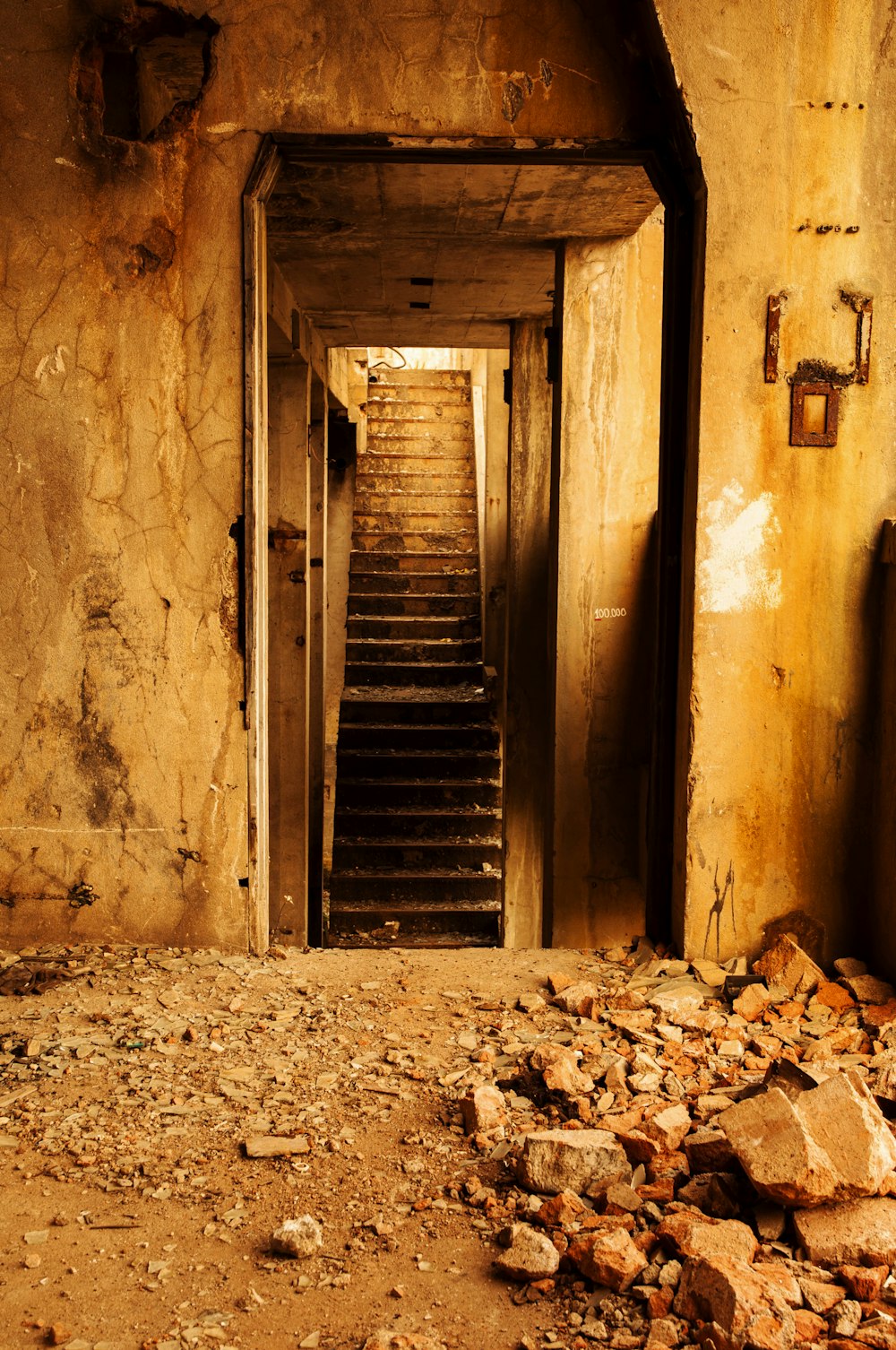 a set of stairs leading up to an abandoned building