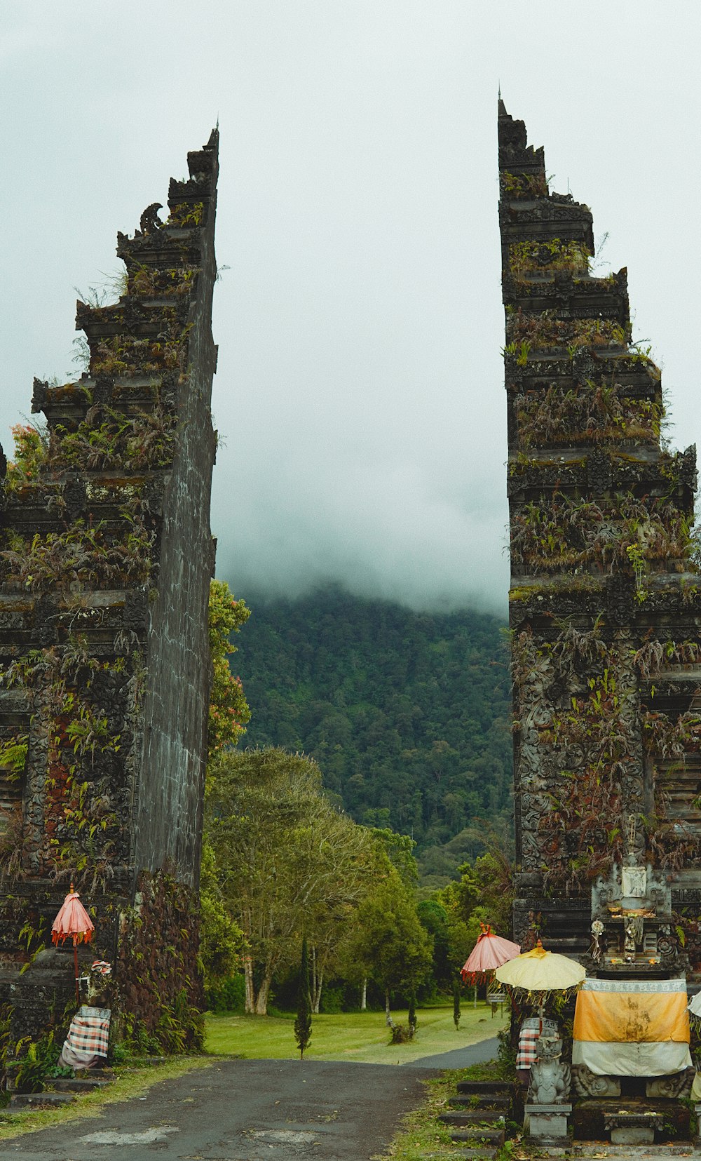 a couple of tall stone towers sitting next to each other