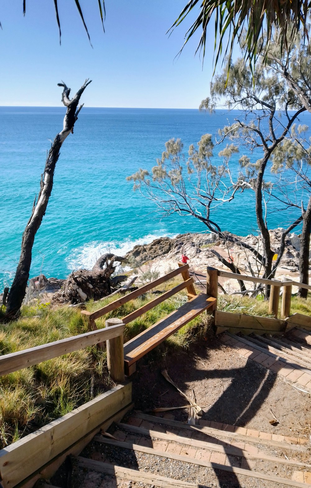 a set of stairs leading down to the ocean