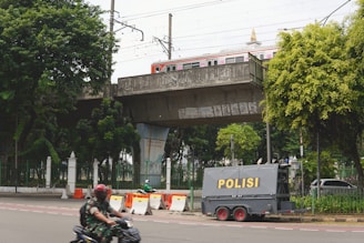 a person riding a motorcycle on a city street
