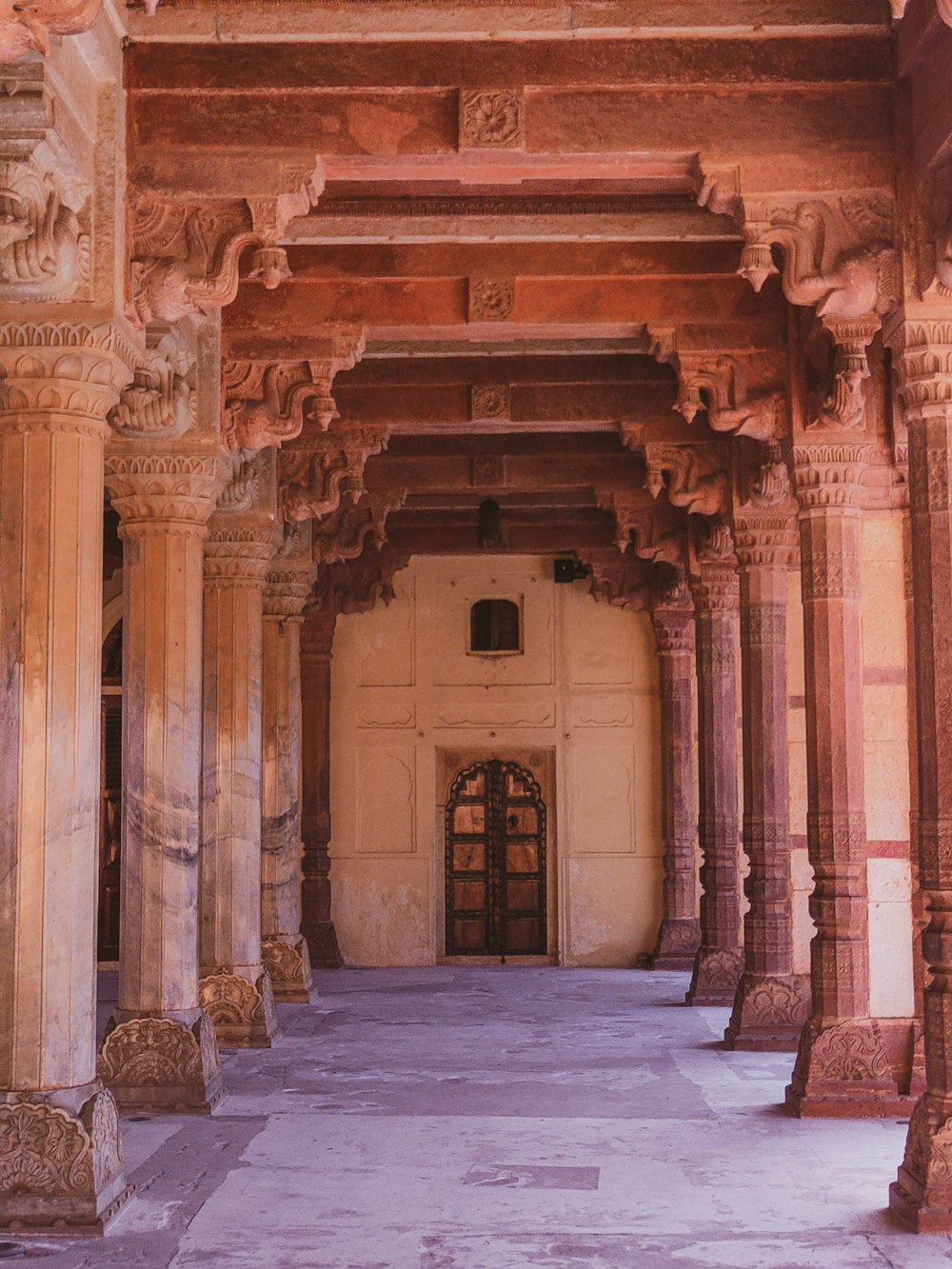 a large building with columns and a doorway