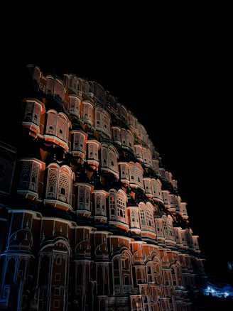 a very tall building with many windows and balconies