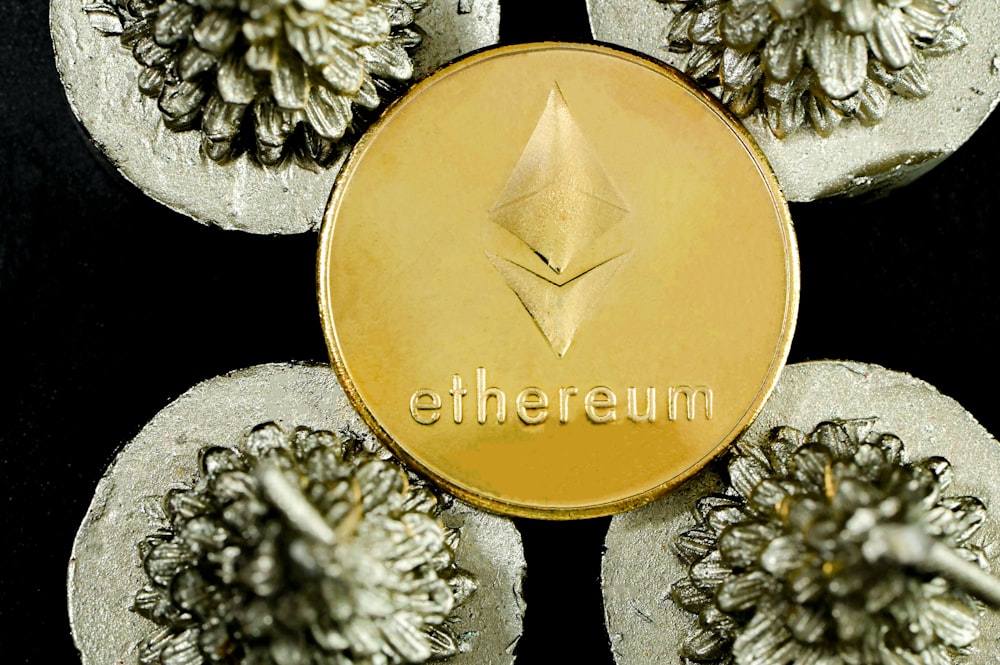 a close up of a gold ether coin