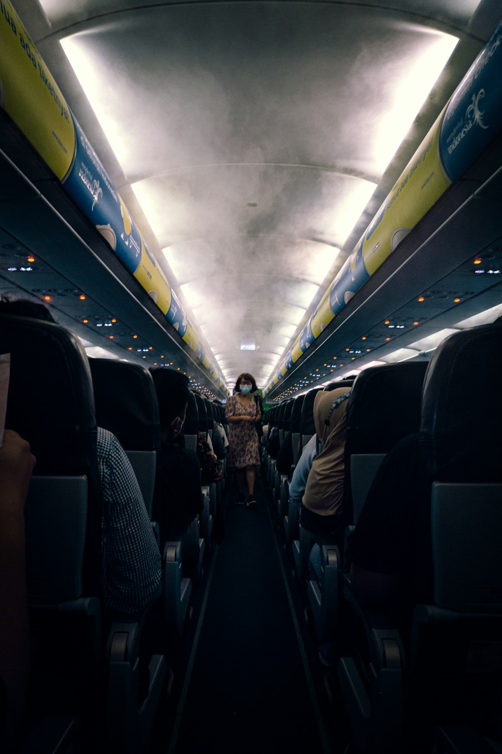 a group of people sitting inside of an airplane