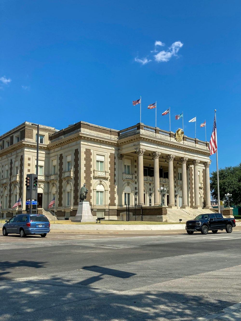 a large building with flags on top of it