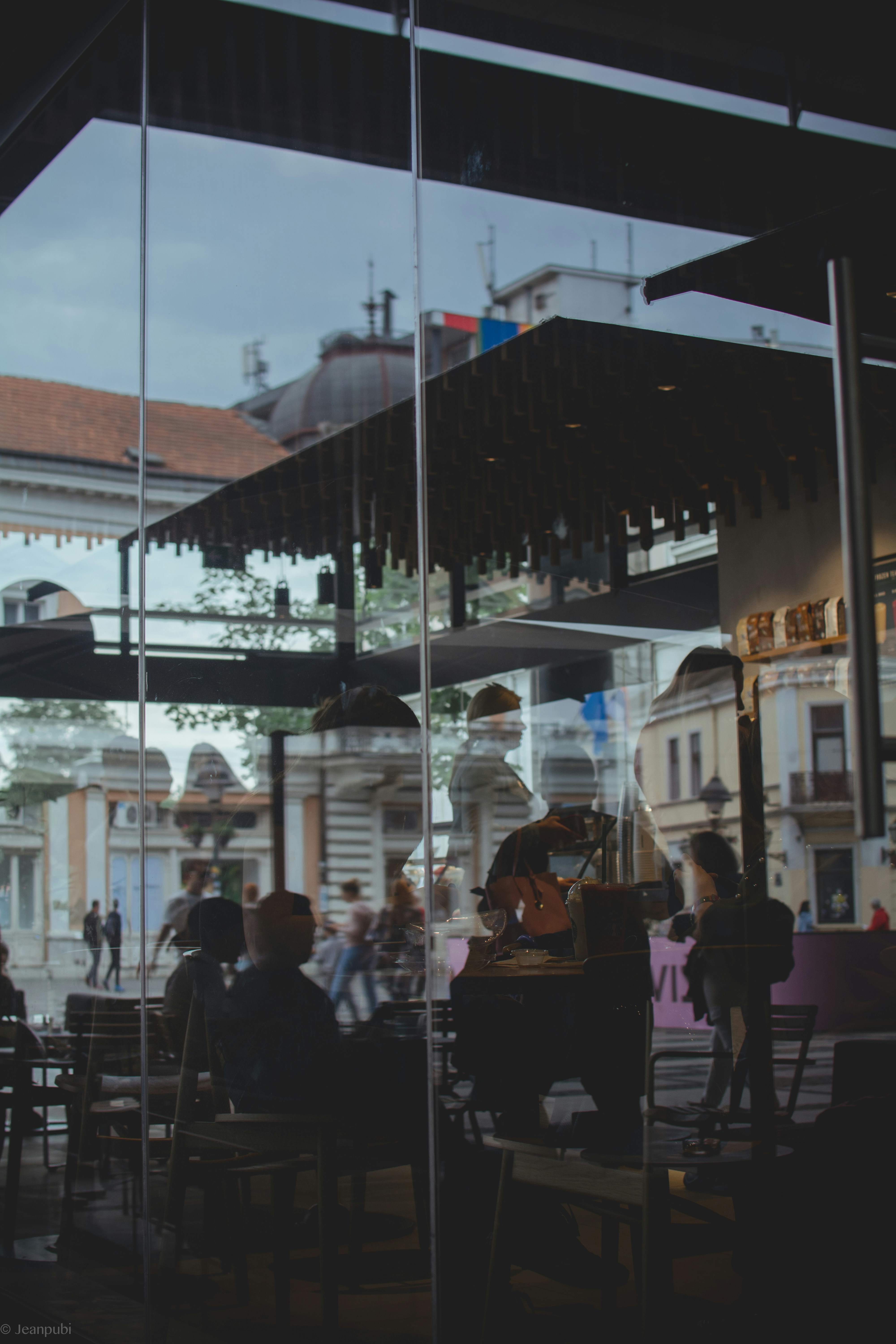a group of people sitting at a table in a restaurant
