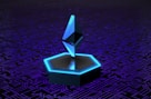 a computer circuit board with a blue light on top of it