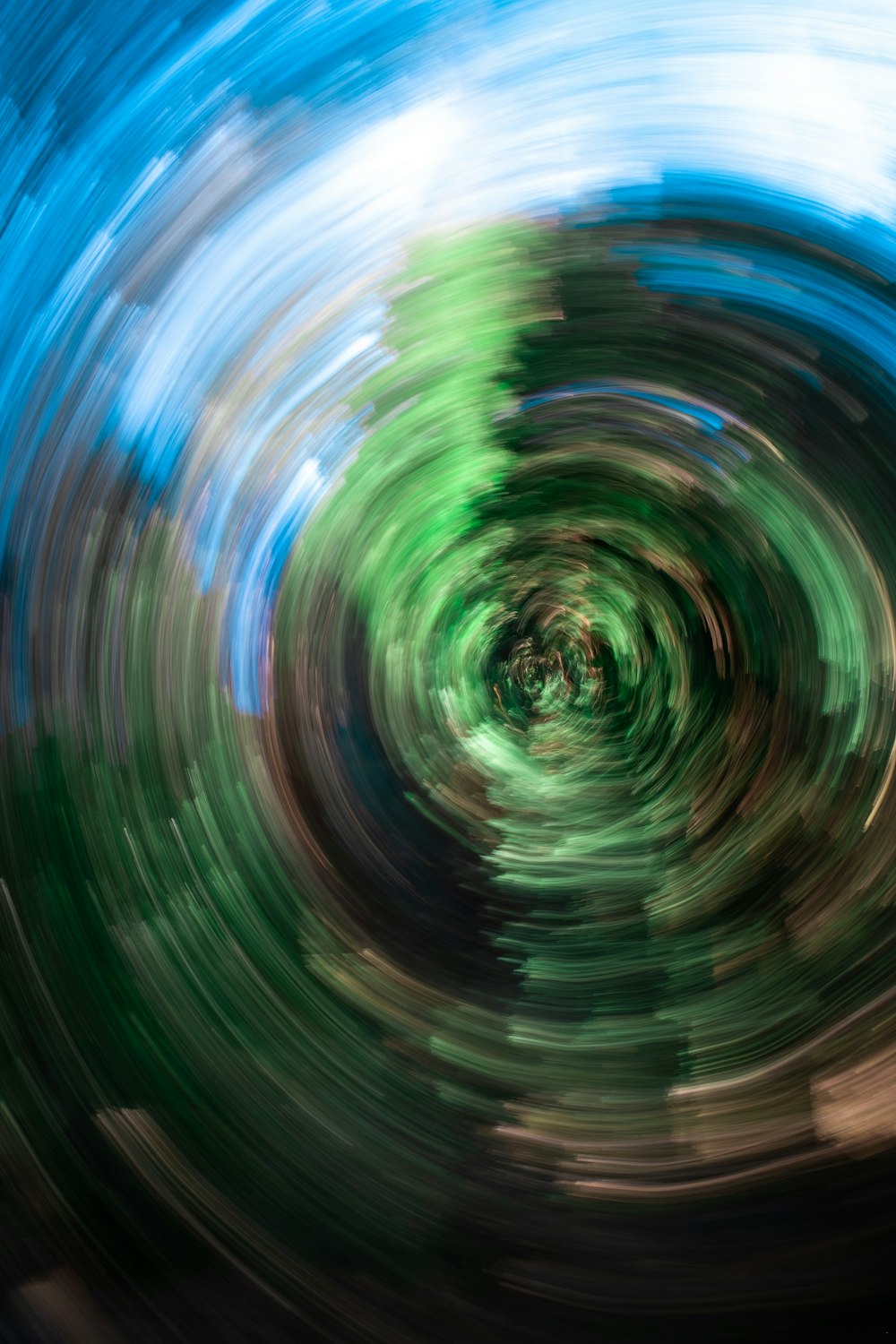 an abstract photo of a green and blue swirl
