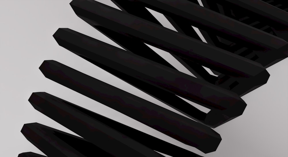 um close up de um objeto preto em uma superfície branca