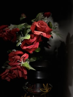 An elegant arrangement of roses in a decorative vase.