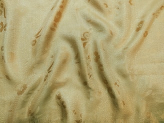 Soft rayon fabrics in vibrant turmeric yellow, suitable for various styles.