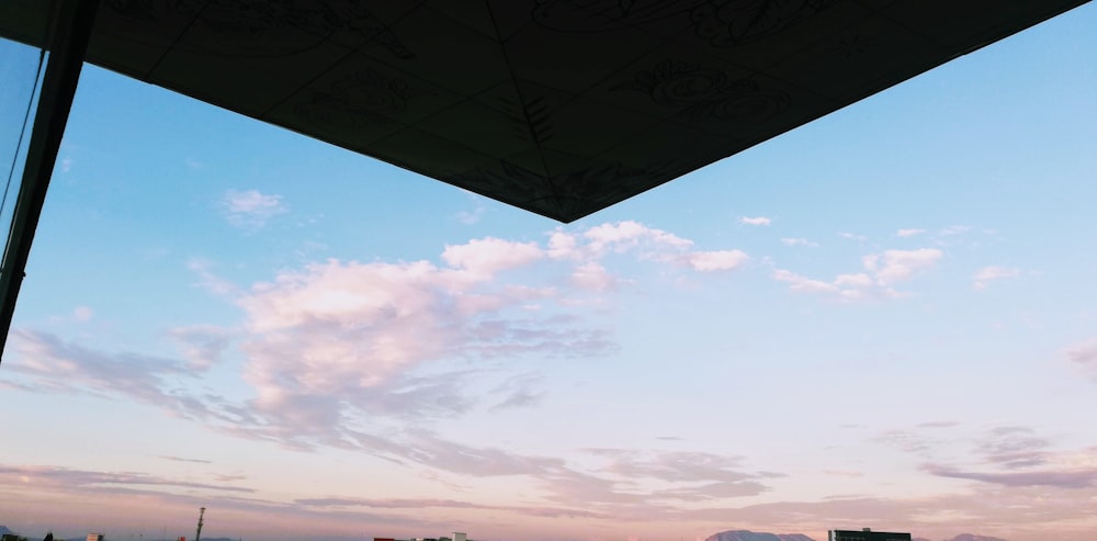 a view of the sky and clouds from a patio