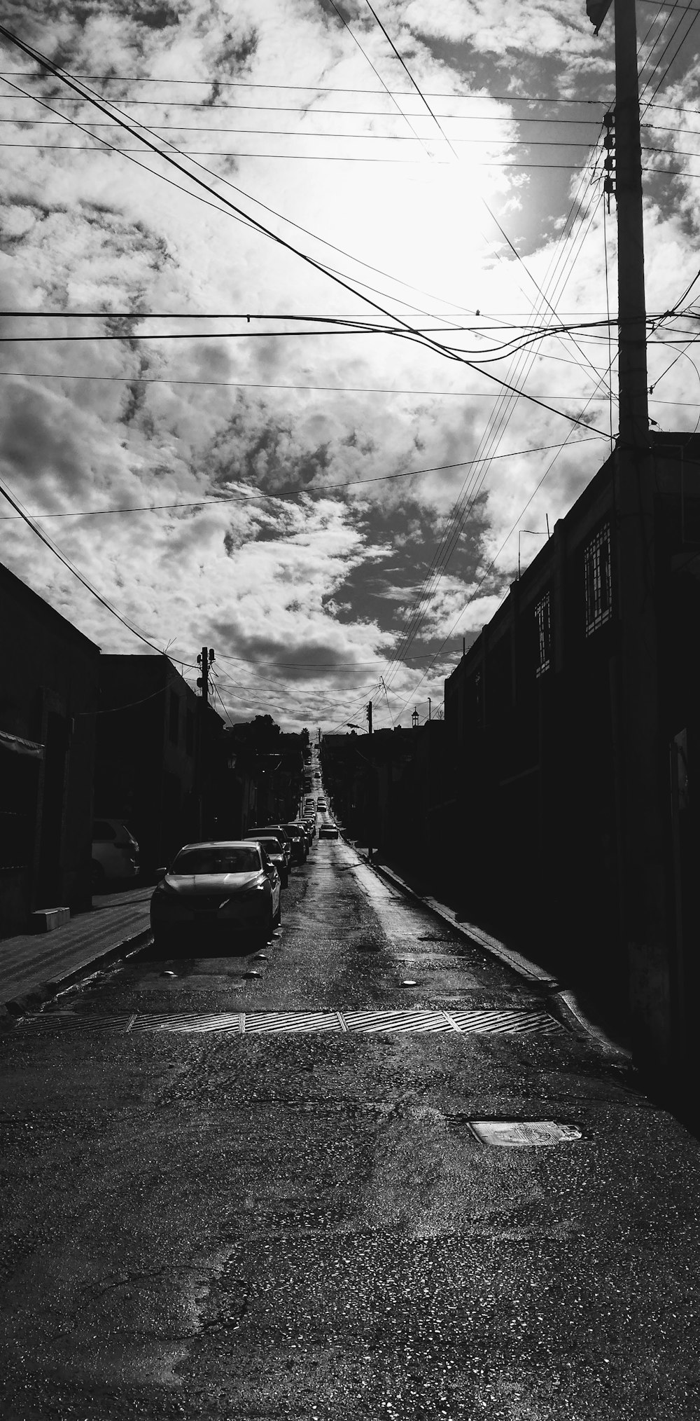 a black and white photo of a street