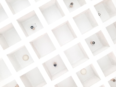 a group of white boxes with black and white buttons on them