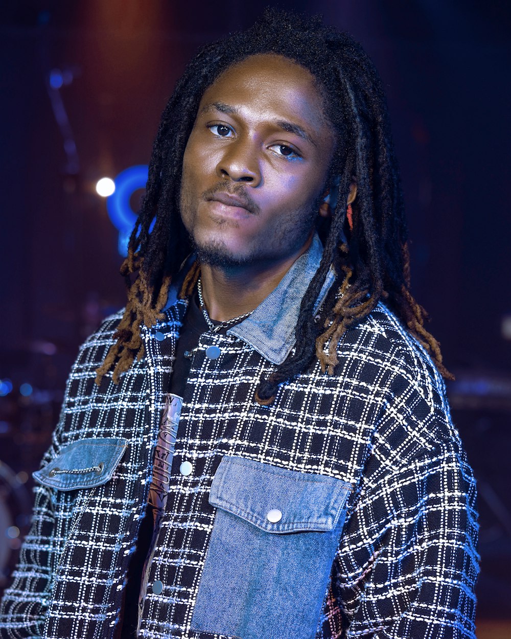 a close up of a person in a blue shirt