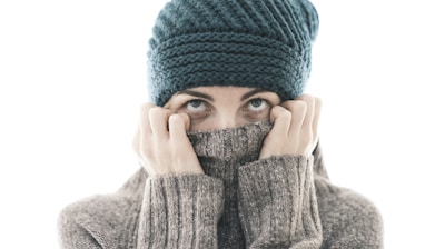 a woman covering her face with her hands