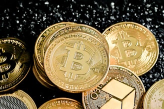 a pile of bitcoins sitting on top of a table
