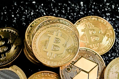 a pile of bitcoins sitting on top of a table