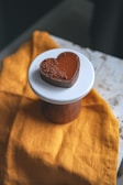 a heart shaped chocolate cake on a white plate