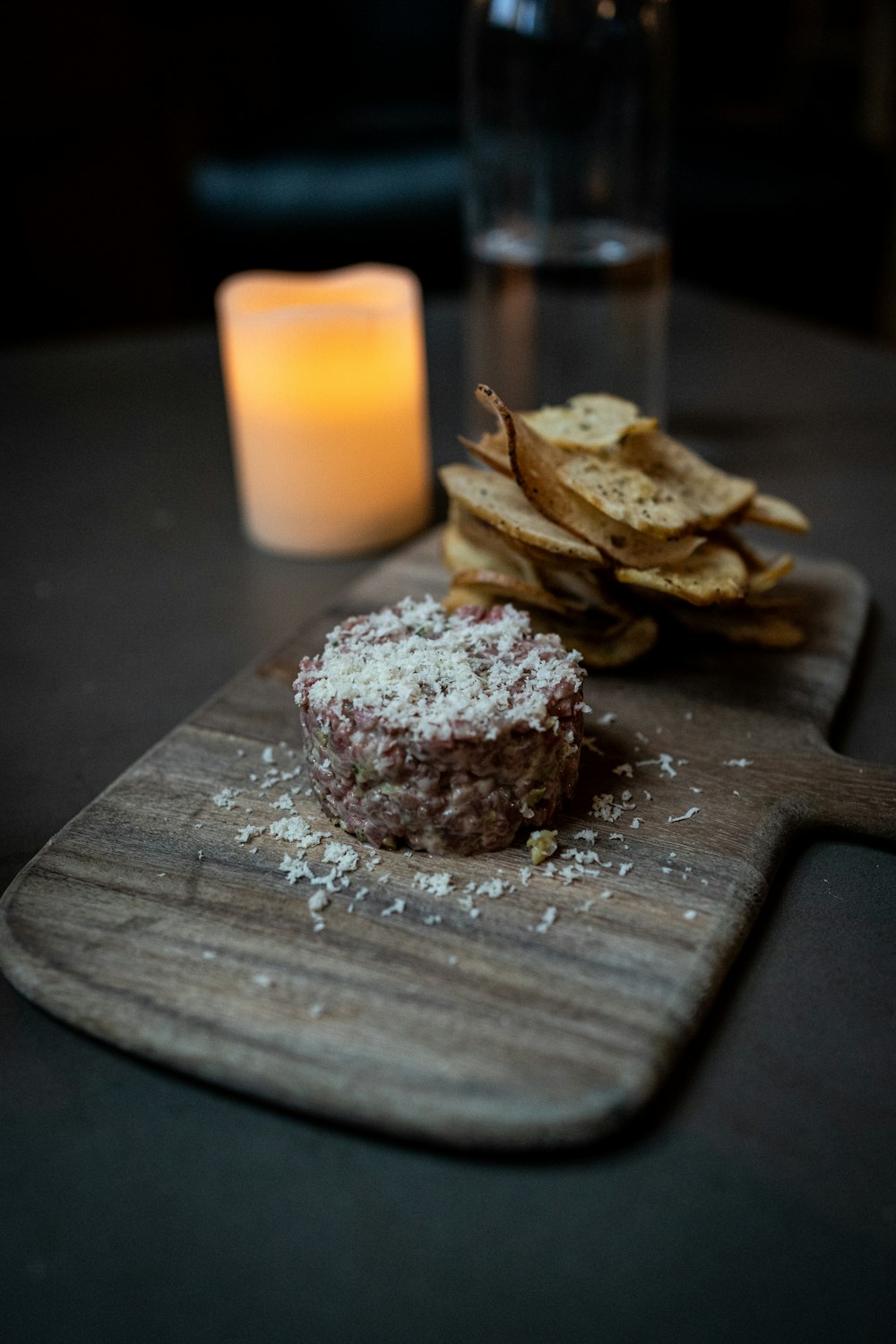 a plate of food and a candle on a table