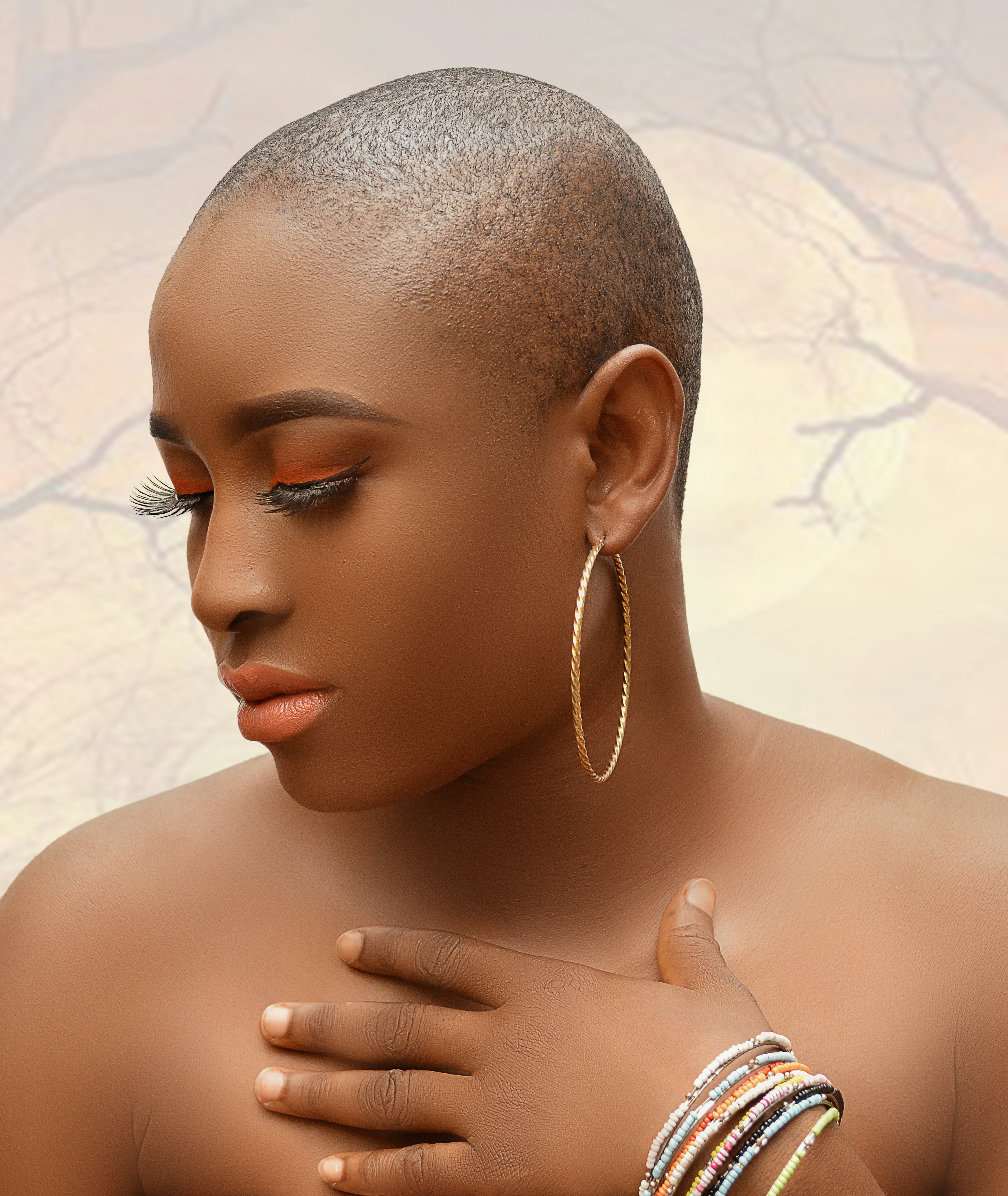 a woman with a pair of hoop earrings on her shoulder