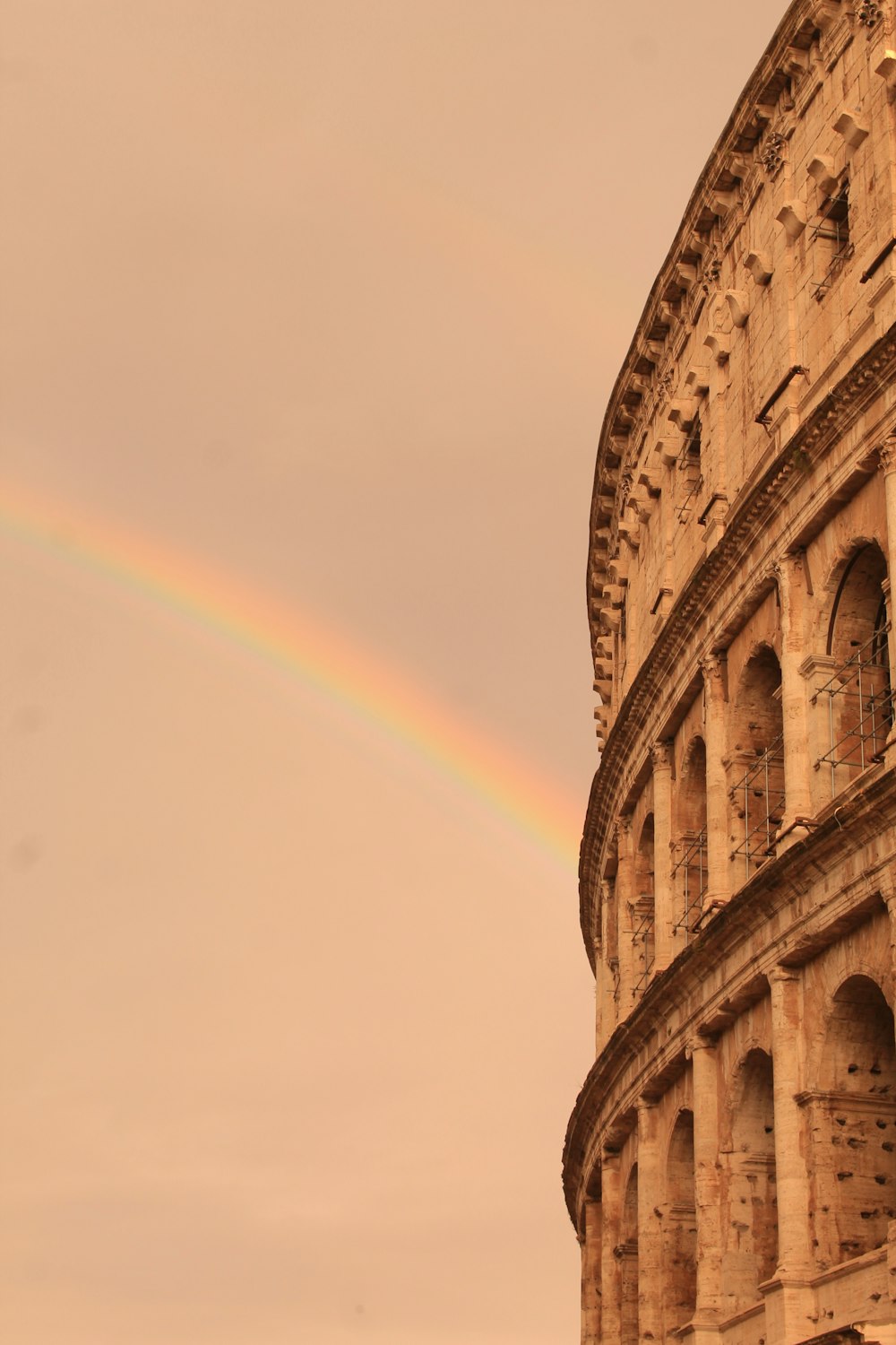a rainbow in the sky over a building