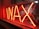 Bright red neon sign displaying the word 'WAX', set against a reflective glass surface, with a glimpse into a dimly lit room behind the sign.