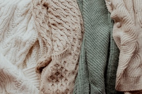 a pile of sweaters sitting next to each other