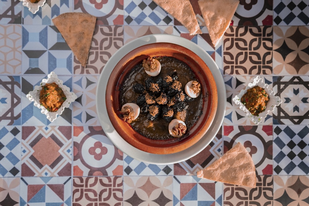 a bowl of food sitting on top of a table