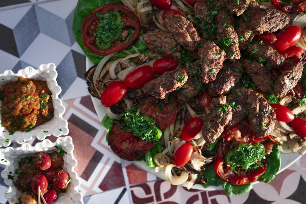 a platter of meat and vegetables on a table