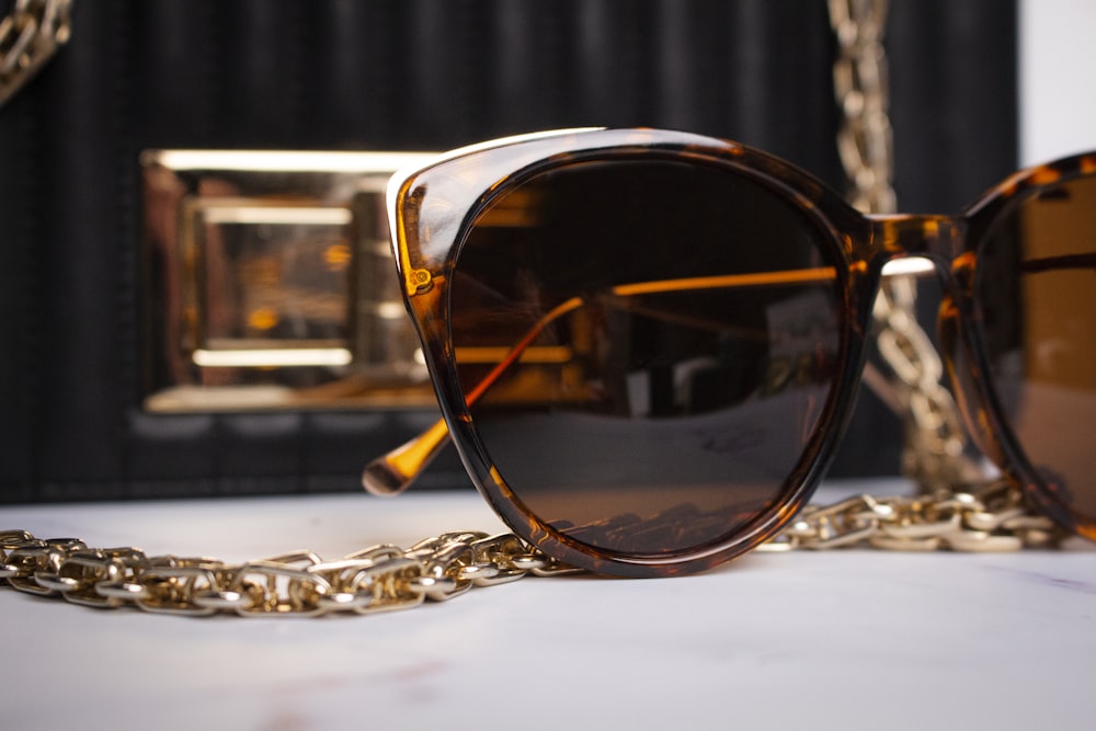 a pair of sunglasses sitting on top of a table