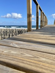 a wooden walkway leading to the beach