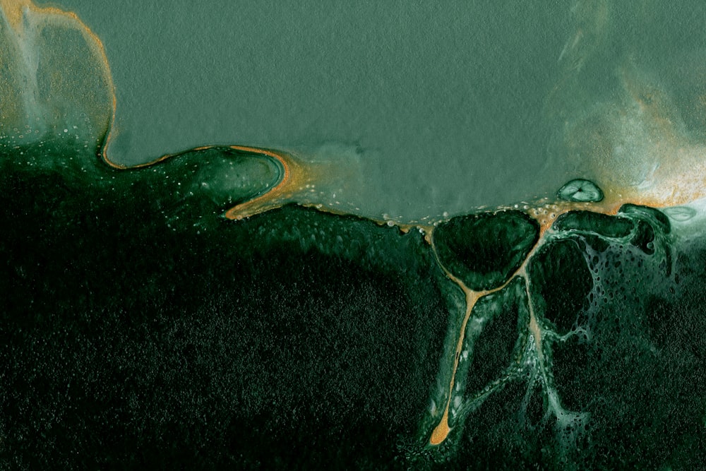 a painting of a green and yellow substance