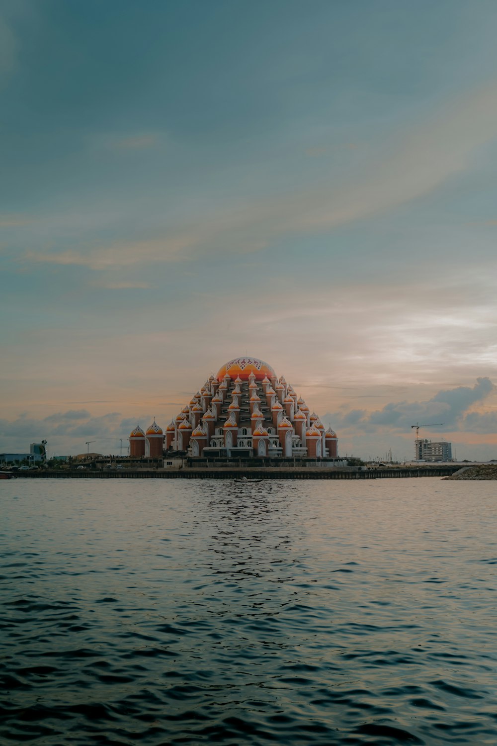 a large building sitting on top of a large body of water