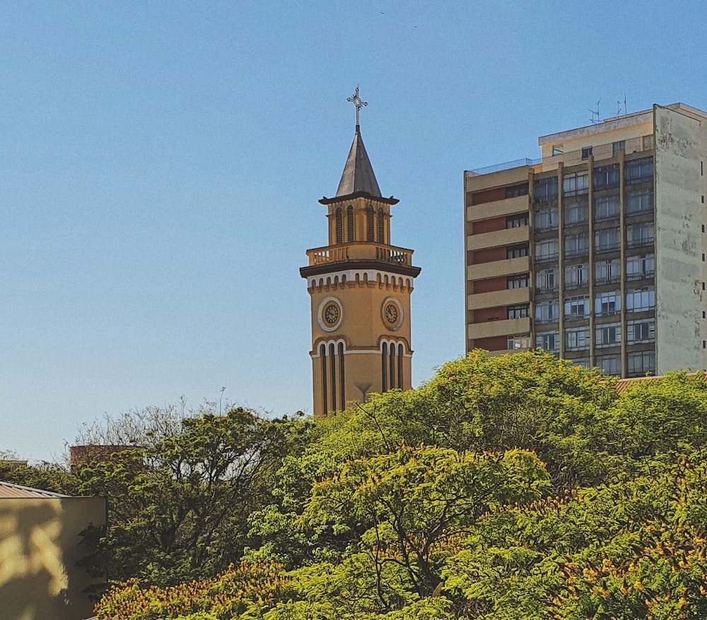 a tall clock tower towering over a city