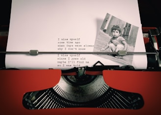 an old typewriter with a picture of a child on it