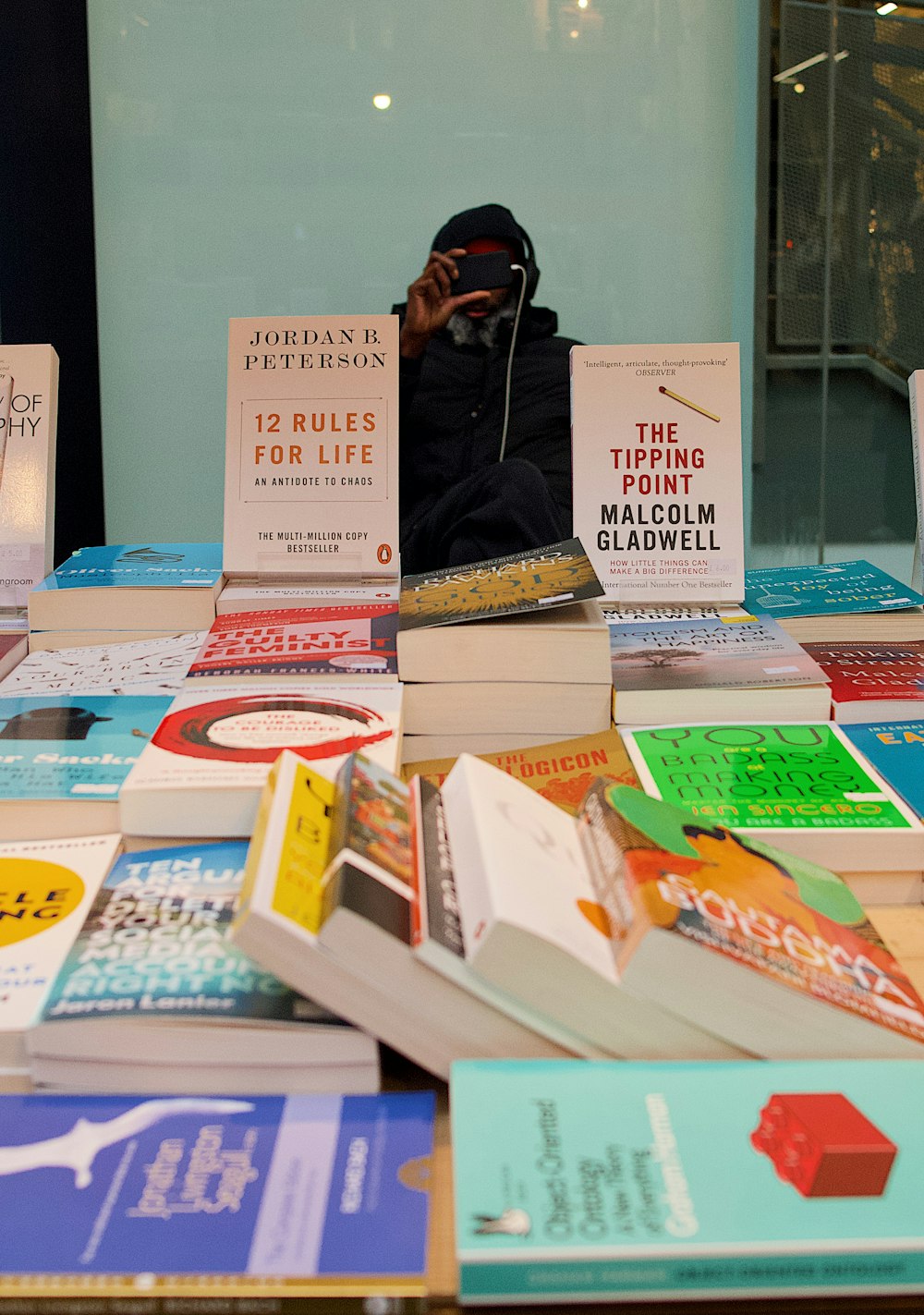 a pile of books sitting on top of a table