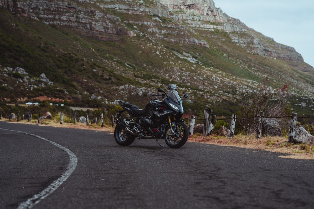 a motorcycle is parked on the side of the road