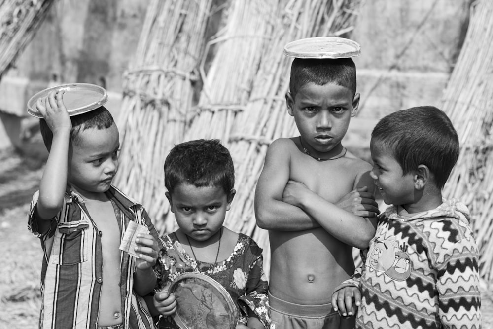 a group of young boys standing next to each other