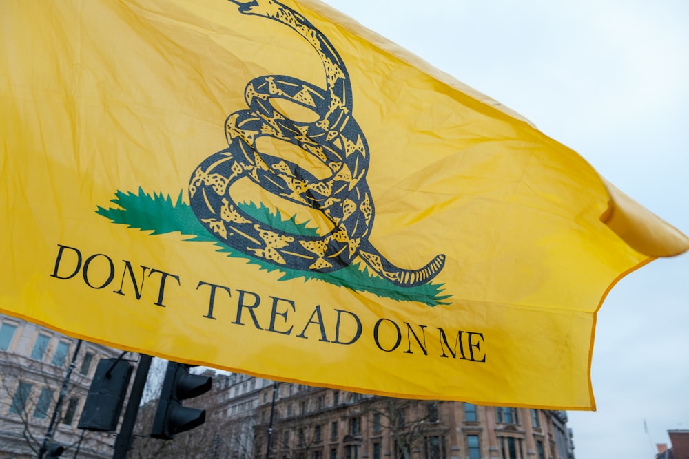a flag with a snake on it and the words don't tread on me