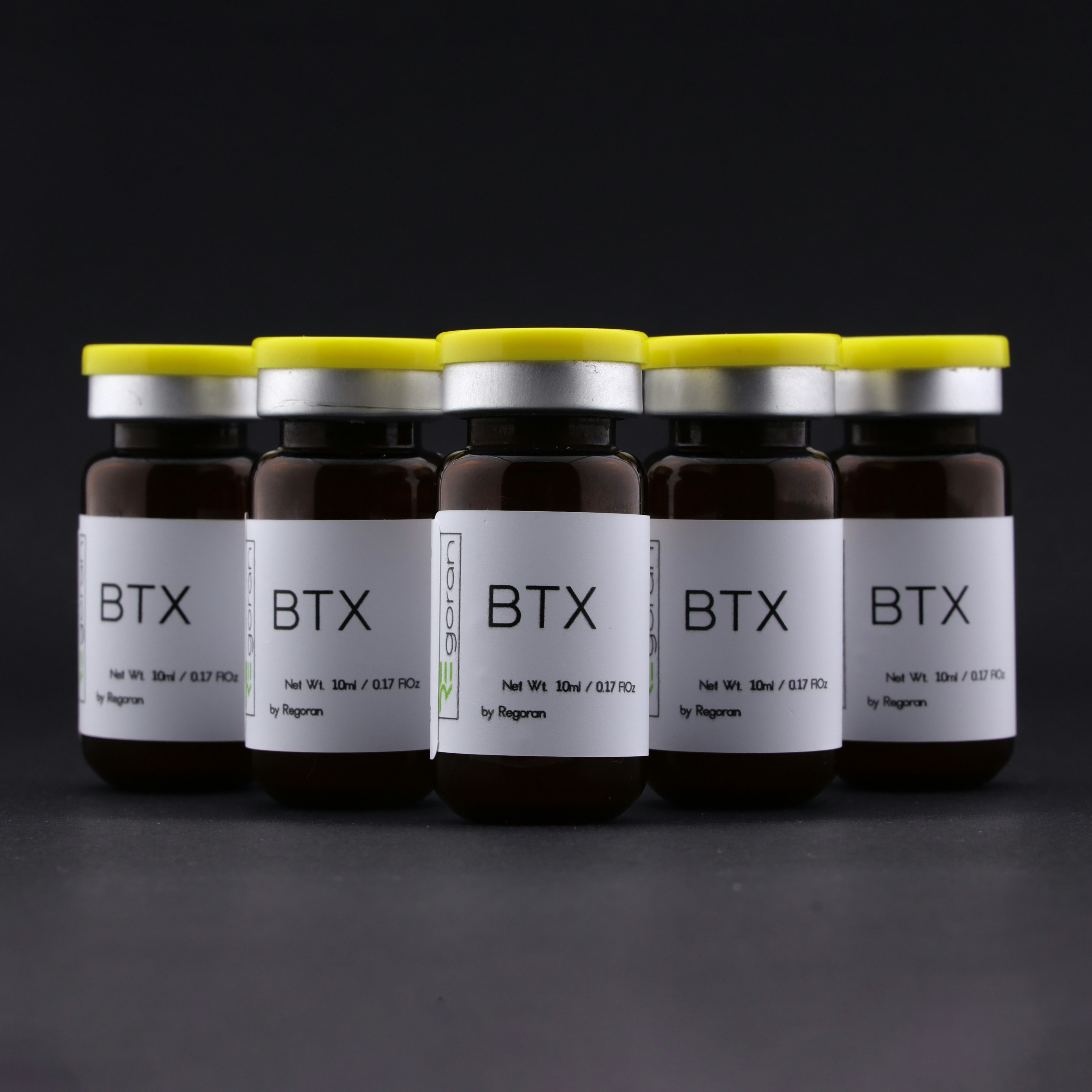 six jars of btx are lined up in a row