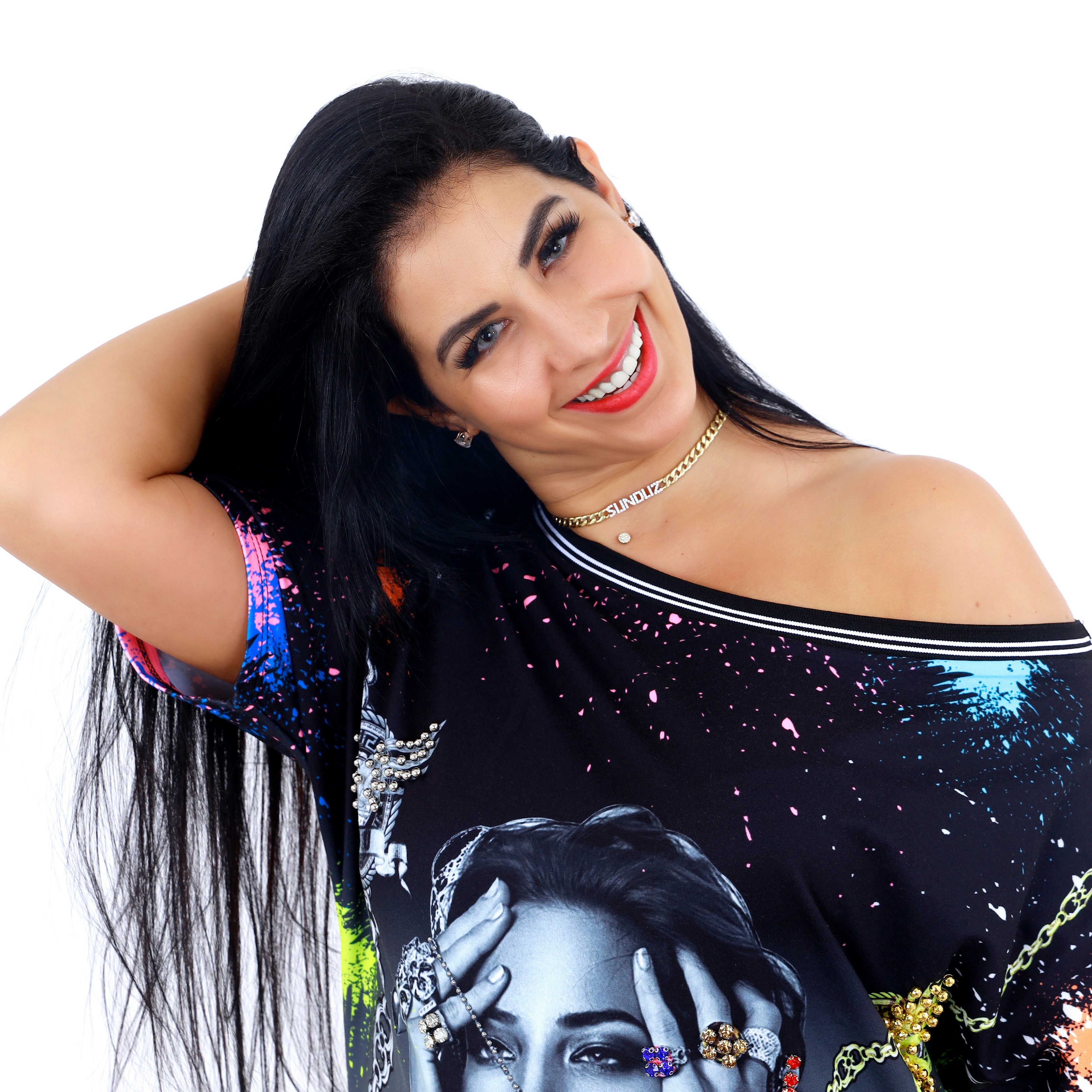 a woman with long black hair wearing a black shirt