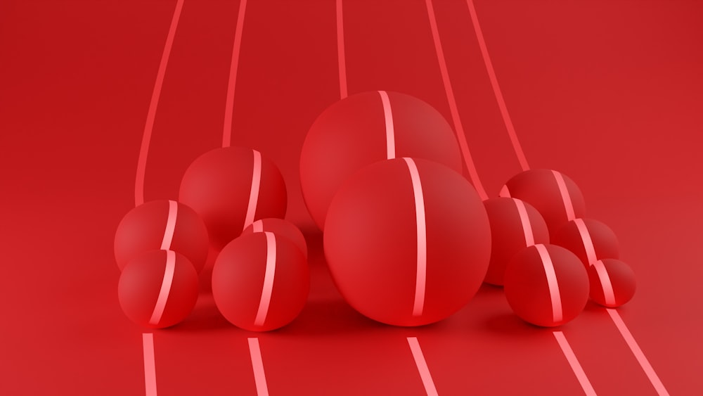 a group of red balls sitting on top of a red floor