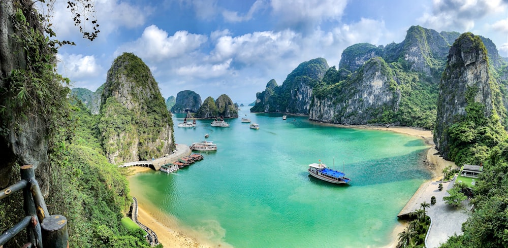 a group of boats floating on top of a body of water