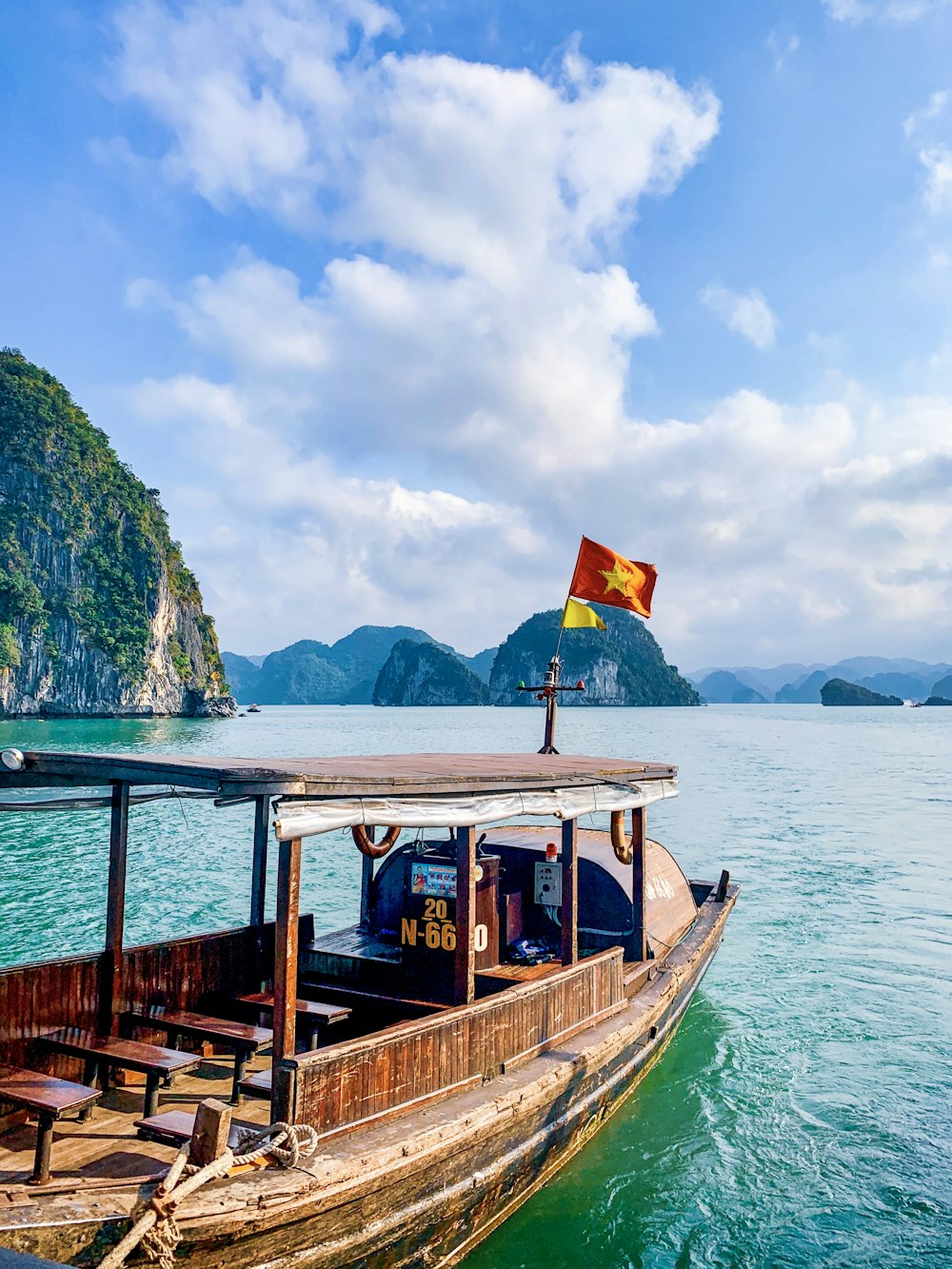 a long boat floating on top of a body of water