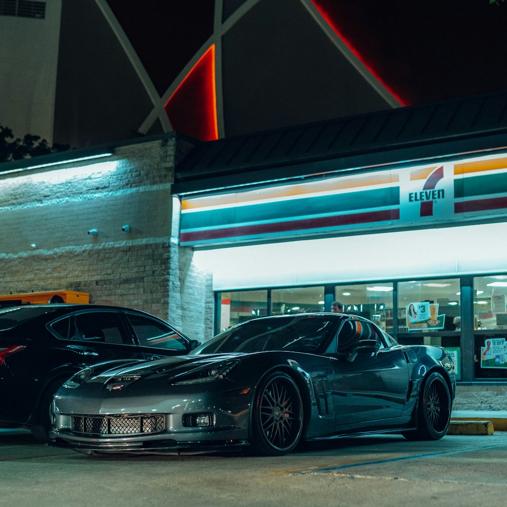 two cars parked in front of a fast food restaurant