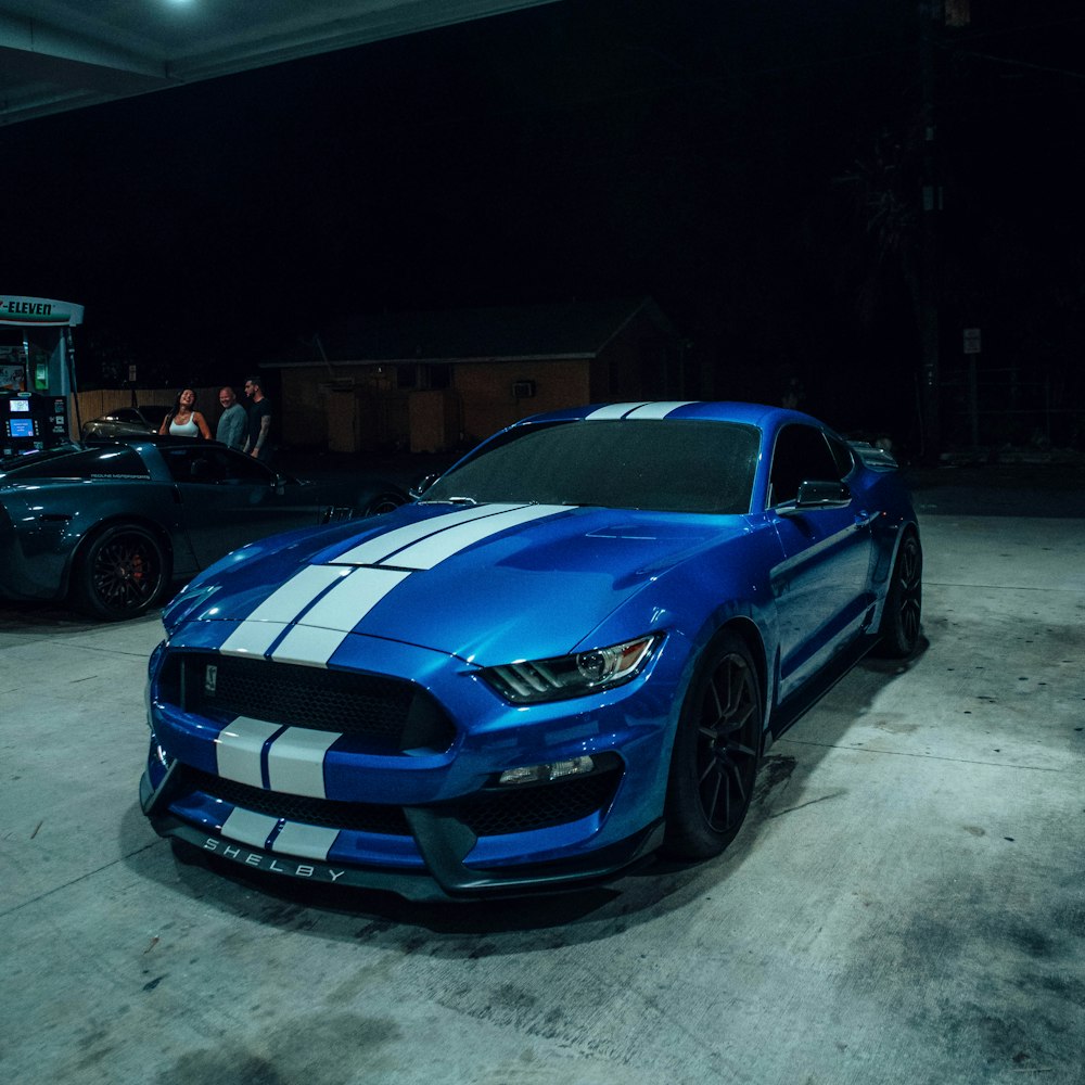 a blue mustang mustang parked in a garage