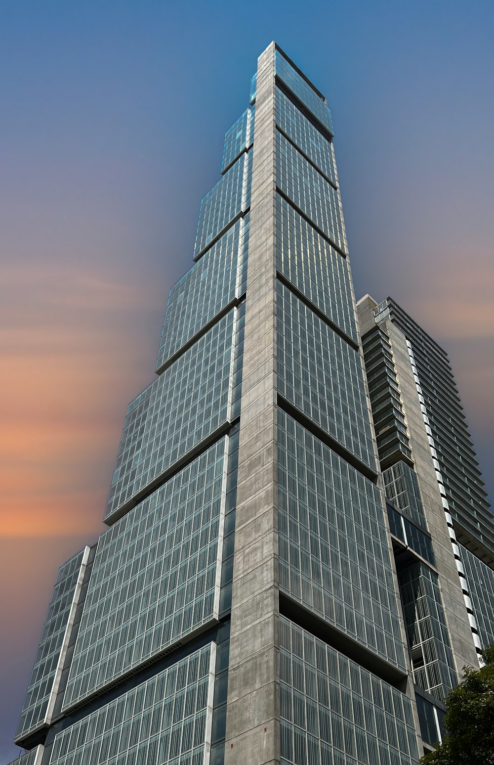 a very tall building with a sky background