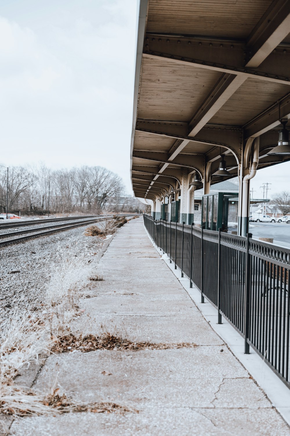 a train station with a train on the tracks