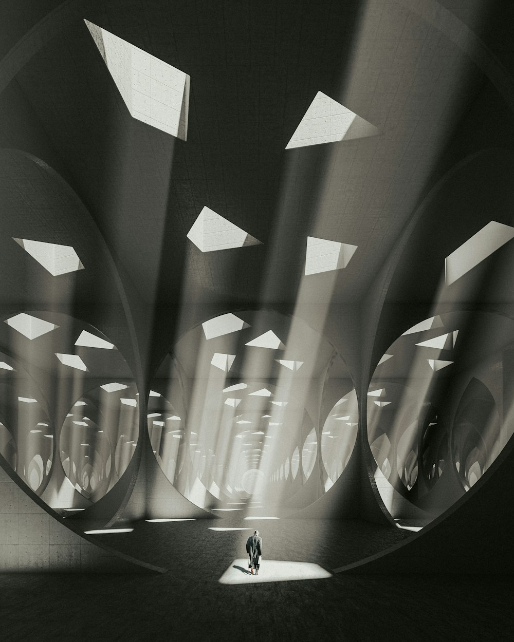 a black and white photo of a person standing in a tunnel